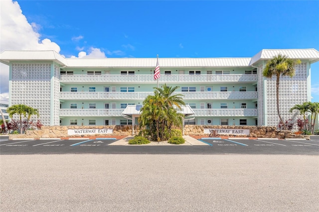 325 N Causeway Unit B305, New Smyrna Beach, FL 32169 - view of building exterior featuring uncovered parking