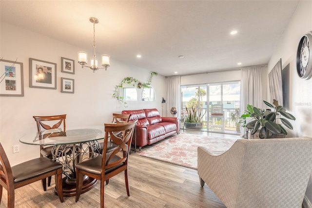 325 N Causeway Unit B305, New Smyrna Beach, FL 32169 - dining room featuring light wood-type flooring, recessed lighting, and a chandelier