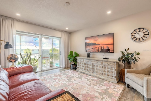 325 N Causeway Unit B305, New Smyrna Beach, FL 32169 - living room with wood finished floors and recessed lighting