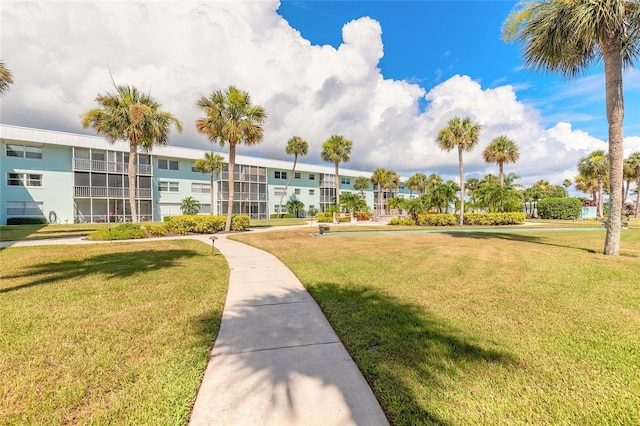 325 N Causeway Unit B305, New Smyrna Beach, FL 32169 - view of property's community featuring a lawn