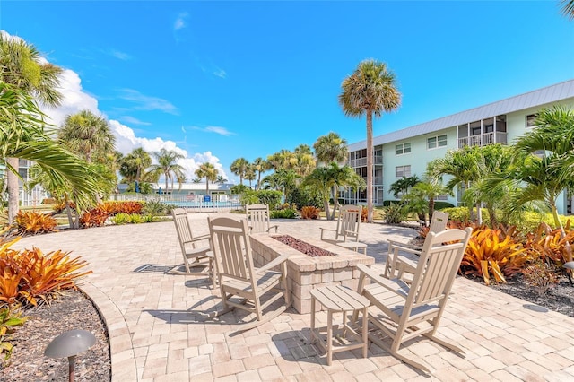 325 N Causeway Unit B305, New Smyrna Beach, FL 32169 - view of patio / terrace featuring a fire pit