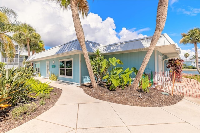 325 N Causeway Unit B305, New Smyrna Beach, FL 32169 - view of front of home featuring a metal roof