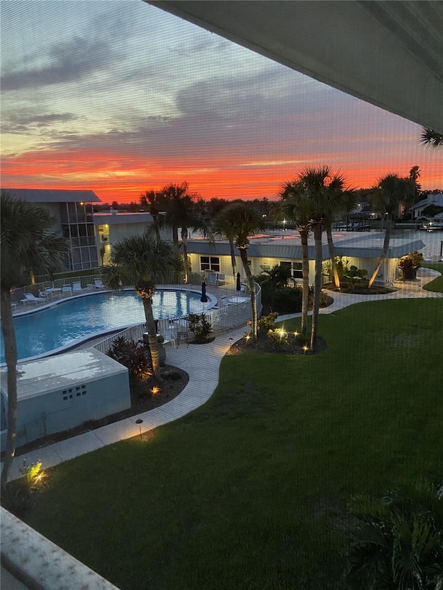 325 N Causeway Unit B305, New Smyrna Beach, FL 32169 - community pool featuring a lawn and a patio
