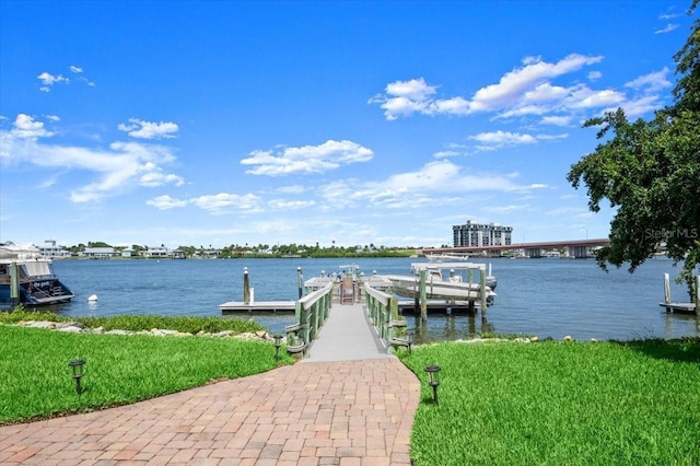 206 Canova Dr, New Smyrna Beach, FL 32169 - dock with a water view and a lawn