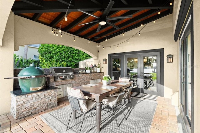206 Canova Dr, New Smyrna Beach, FL 32169 - view of patio / terrace featuring french doors, area for grilling, ceiling fan, and outdoor dining area
