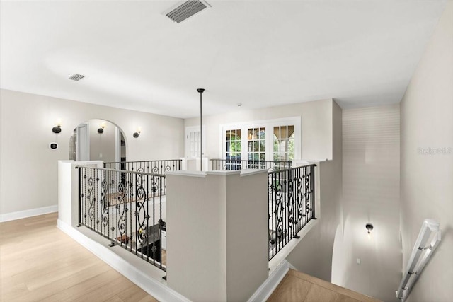 206 Canova Dr, New Smyrna Beach, FL 32169 - hallway with an upstairs landing and wood finished floors