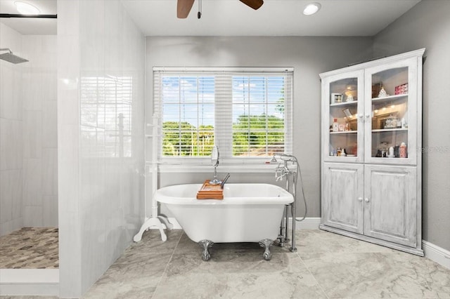 206 Canova Dr, New Smyrna Beach, FL 32169 - full bath with a ceiling fan, a walk in shower, and a freestanding bath