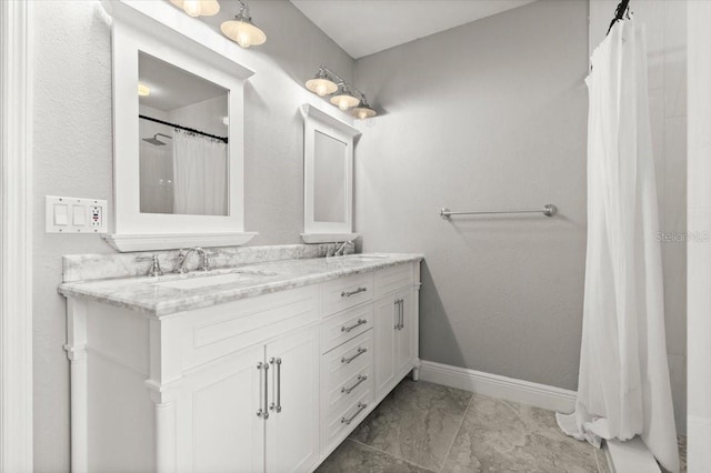 206 Canova Dr, New Smyrna Beach, FL 32169 - bathroom featuring double vanity, curtained shower, and marble look tile flooring