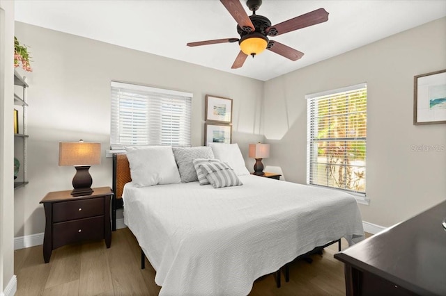 206 Canova Dr, New Smyrna Beach, FL 32169 - bedroom with wood finished floors and ceiling fan