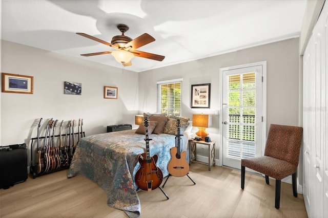 206 Canova Dr, New Smyrna Beach, FL 32169 - bedroom with access to outside, light wood-style floors, and ceiling fan