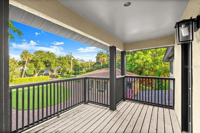 206 Canova Dr, New Smyrna Beach, FL 32169 - wooden terrace with a lawn and view of wooded area