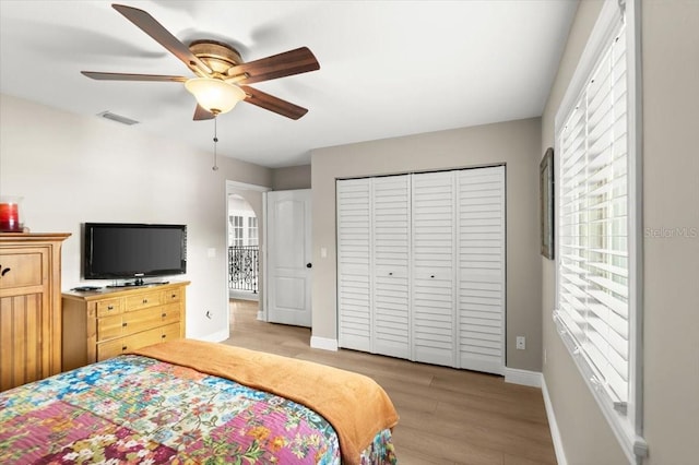 206 Canova Dr, New Smyrna Beach, FL 32169 - bedroom featuring light wood finished floors, a closet, and a ceiling fan