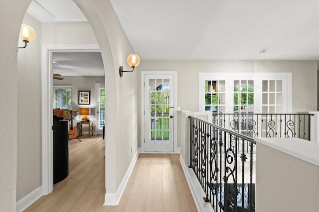 206 Canova Dr, New Smyrna Beach, FL 32169 - hall with wood finished floors and arched walkways