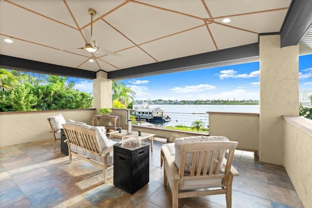 206 Canova Dr, New Smyrna Beach, FL 32169 - view of patio featuring a ceiling fan, a water view, an outdoor living space, and a gazebo
