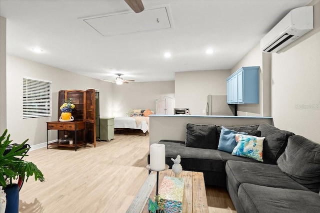 206 Canova Dr, New Smyrna Beach, FL 32169 - living area with attic access, a wall unit AC, light wood-style floors, ceiling fan, and recessed lighting