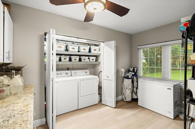 206 Canova Dr, New Smyrna Beach, FL 32169 - laundry area featuring independent washer and dryer, a ceiling fan, and light wood-style flooring