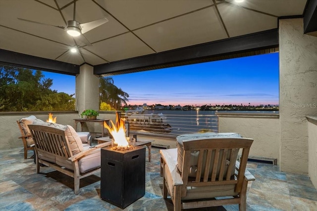206 Canova Dr, New Smyrna Beach, FL 32169 - patio terrace at dusk featuring an outdoor fire pit and a patio