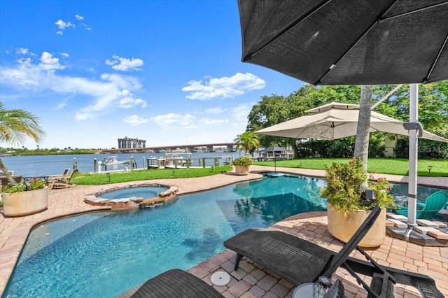 206 Canova Dr, New Smyrna Beach, FL 32169 - view of pool with a pool with connected hot tub, a water view, and a patio area
