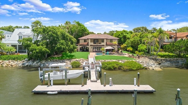 206 Canova Dr, New Smyrna Beach, FL 32169 - dock area with a water view and a lawn