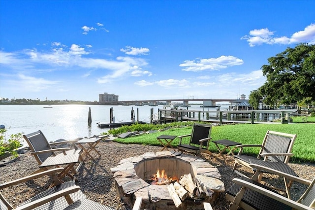 206 Canova Dr, New Smyrna Beach, FL 32169 - view of patio with a boat dock, an outdoor fire pit, and a water view