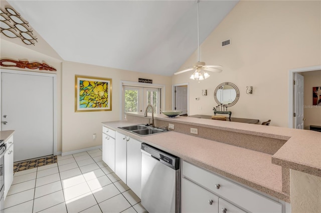 527 Old Minorcan Trl, New Smyrna Beach, FL 32168 - kitchen featuring stainless steel dishwasher, light countertops, high vaulted ceiling, ceiling fan, and white cabinets