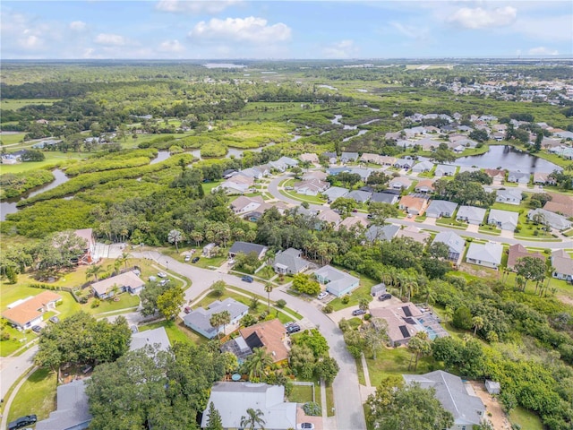 527 Old Minorcan Trl, New Smyrna Beach, FL 32168 - aerial overview of property's location with nearby suburban area and a nearby body of water
