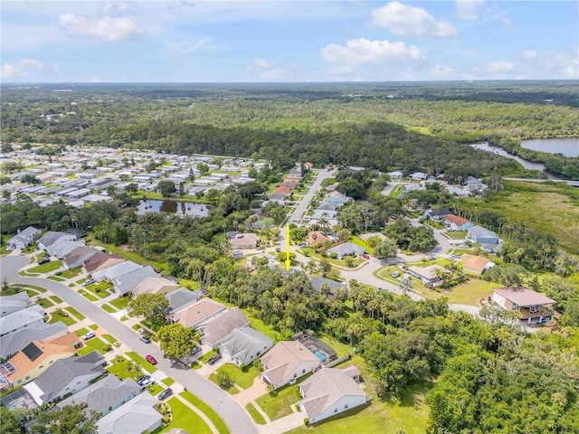 527 Old Minorcan Trl, New Smyrna Beach, FL 32168 - aerial view of residential area with a heavily wooded area and a nearby body of water