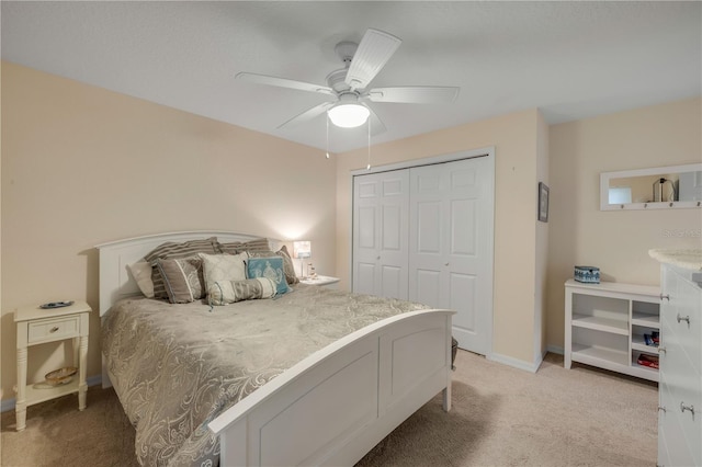 527 Old Minorcan Trl, New Smyrna Beach, FL 32168 - bedroom with light colored carpet, a closet, and a ceiling fan