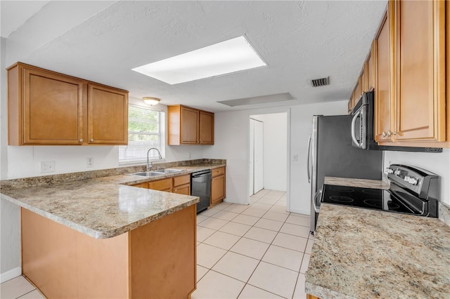 3132 Pine Tree Dr, Edgewater, FL 32141 - kitchen with stainless steel range with electric cooktop, a peninsula, dishwashing machine, brown cabinets, and light tile patterned floors