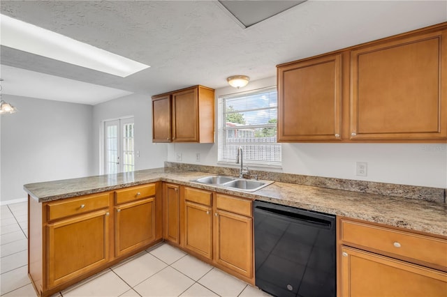 3132 Pine Tree Dr, Edgewater, FL 32141 - kitchen featuring black dishwasher, a peninsula, light tile patterned flooring, brown cabinets, and a textured ceiling