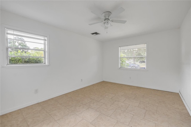 3132 Pine Tree Dr, Edgewater, FL 32141 - spare room with healthy amount of natural light and a ceiling fan