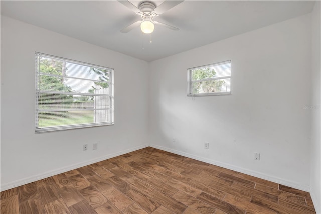 3132 Pine Tree Dr, Edgewater, FL 32141 - unfurnished room featuring wood finished floors and a ceiling fan