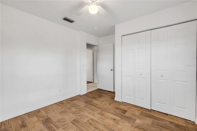 3132 Pine Tree Dr, Edgewater, FL 32141 - unfurnished bedroom with light wood-style flooring, a closet, and a ceiling fan