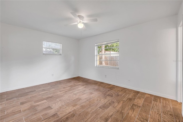 3132 Pine Tree Dr, Edgewater, FL 32141 - unfurnished room with light wood finished floors and ceiling fan