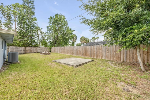 3132 Pine Tree Dr, Edgewater, FL 32141 - fenced backyard featuring a fire pit