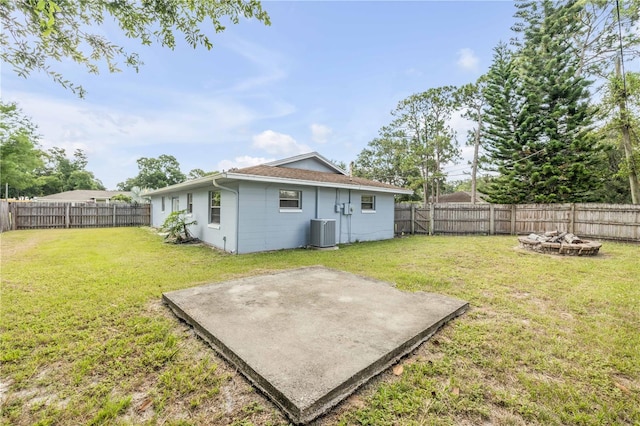 3132 Pine Tree Dr, Edgewater, FL 32141 - fenced backyard featuring an outdoor fire pit and a patio area