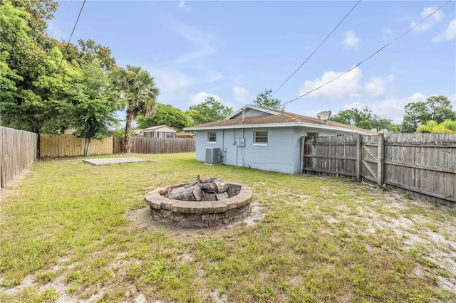 3132 Pine Tree Dr, Edgewater, FL 32141 - fenced backyard featuring an outdoor fire pit