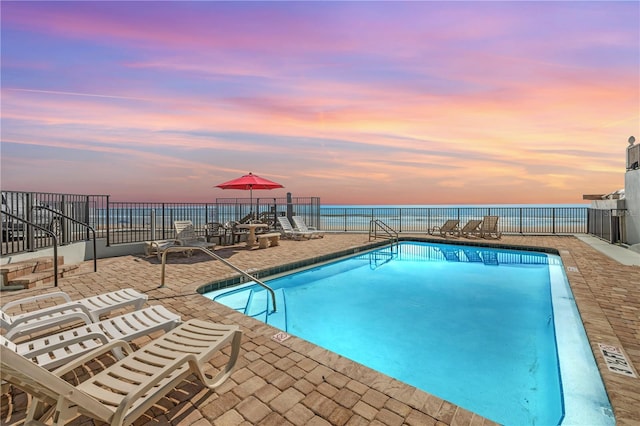 1404 N Atlantic Ave Unit 70, Daytona Beach, FL 32118 - community pool with a patio area and a water view