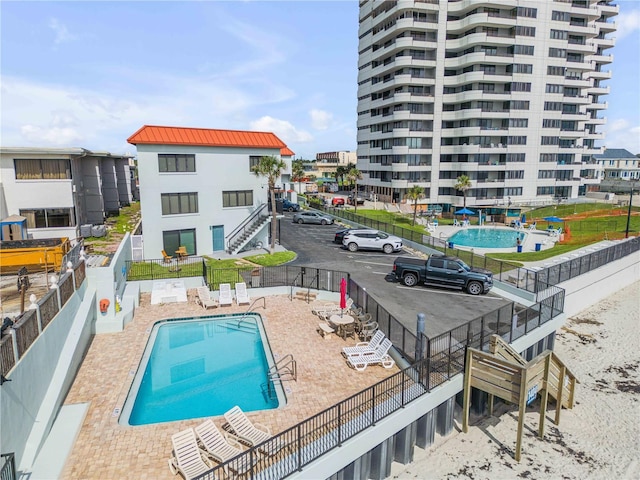 1404 N Atlantic Ave Unit 70, Daytona Beach, FL 32118 - community pool featuring a patio