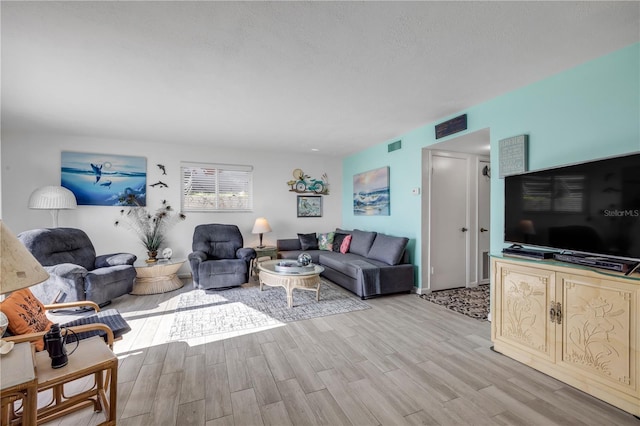 1404 N Atlantic Ave Unit 70, Daytona Beach, FL 32118 - living room with light wood-type flooring