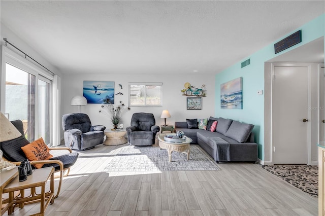 1404 N Atlantic Ave Unit 70, Daytona Beach, FL 32118 - living room featuring wood finished floors and baseboards