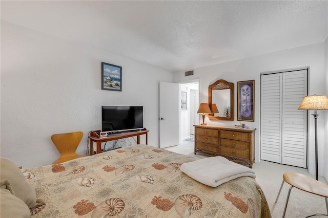 1404 N Atlantic Ave Unit 70, Daytona Beach, FL 32118 - carpeted bedroom featuring a closet and a textured ceiling