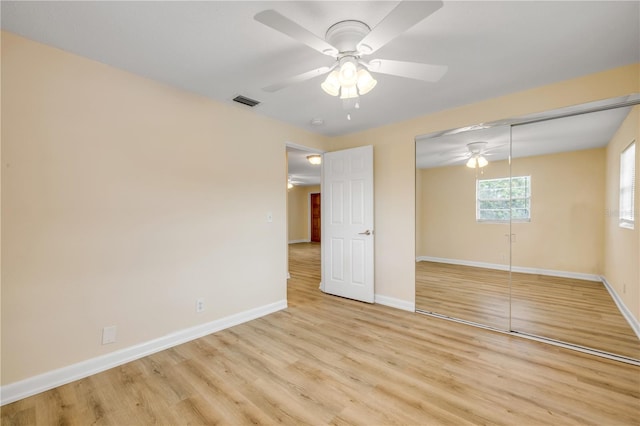1750 S Palmetto Ave Unit 24, Daytona Beach, FL 32119 - unfurnished bedroom featuring light wood finished floors, a closet, and a ceiling fan