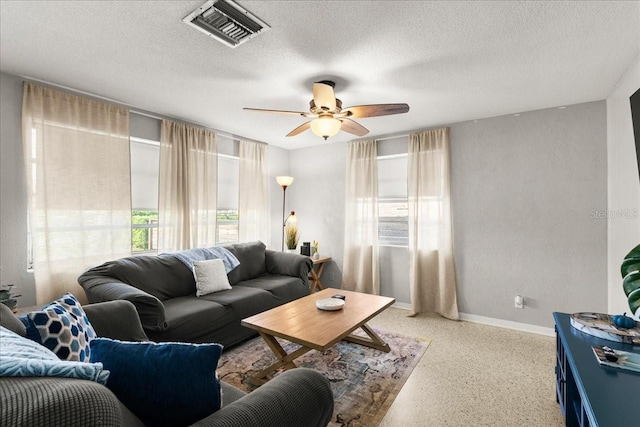 211 Fox Pl, Port Orange, FL 32127 - living area featuring speckled floor, plenty of natural light, ceiling fan, and a textured ceiling
