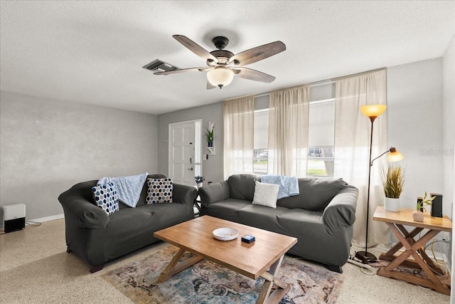 211 Fox Pl, Port Orange, FL 32127 - living area featuring speckled floor, ceiling fan, and a textured ceiling
