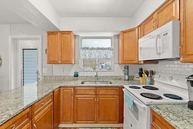 211 Fox Pl, Port Orange, FL 32127 - kitchen featuring white appliances, backsplash, and light stone countertops