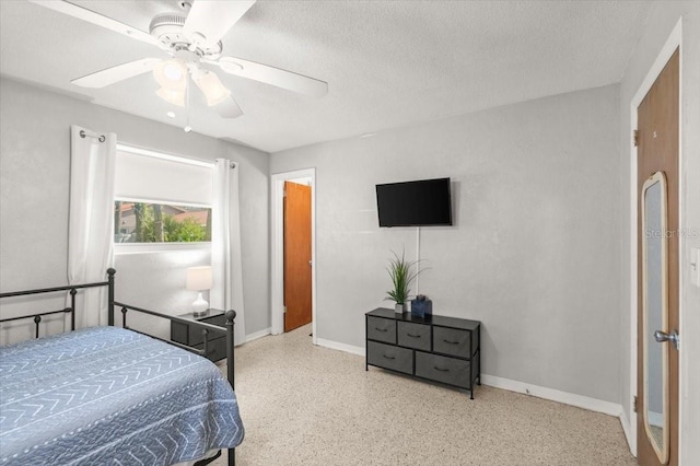 211 Fox Pl, Port Orange, FL 32127 - bedroom featuring speckled floor, a textured ceiling, and ceiling fan