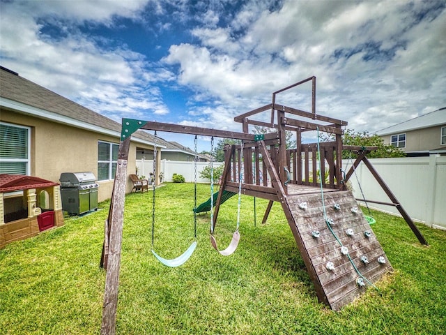 2731 Star Coral Ln, New Smyrna Beach, FL 32168 - view of jungle gym with a fenced backyard