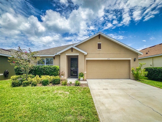 2731 Star Coral Ln, New Smyrna Beach, FL 32168 - view of front of house with stucco siding, an attached garage, concrete driveway, and a front lawn