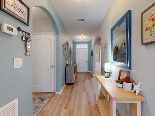 2731 Star Coral Ln, New Smyrna Beach, FL 32168 - hall with light wood-type flooring and arched walkways